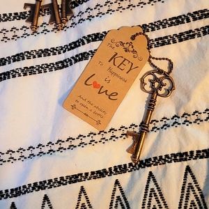 20 key bottle openers with love tags